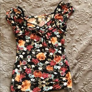 Floral shirt with black lace detail.